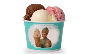 Three scoops of ice cream in a turquoise cup with chocolate, vanilla, and strawberry flavors for event dessert catering